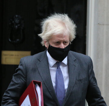 EMBATTLED BORIS JOHNSON AIMS TO LIFT U.K.’S SELF-ISOLATING LAW