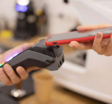 Close,Up,Of,A,Woman,Hand,Holding,A,Smartphone,With BLOCKCHAIN BATTLES