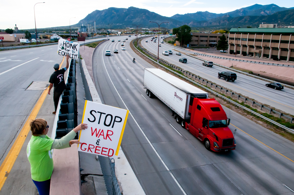 Colorado,Springs,-,October,15th,,2011,-,Occupycoloradosprings,Protestors,Hold CAN INNOVATION OUTPACE GREED, WAR AND CORRUPTION?