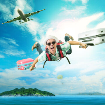 Young,Man,Flying,From,Passenger,Plane,To,Natural,Destination,Island BUSINESS TRAVEL BUST