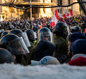 Ottawa,,Ontario,,Canada,-,February,18,,2022:,Trucker,Freedom,Convoy CANADIANS CAN THANK BIDEN FOR FORCED VACCINE MANDATES AND CRUSHING THEIR PROTEST RIGHTS