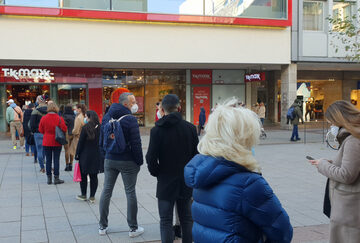 Retail consumers waiting in line