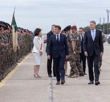French President Emmanuel Macron reviewing the troops
