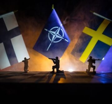 Flags of Sweden and Finland and compass