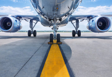 undercarriage of aircraft on tarmac