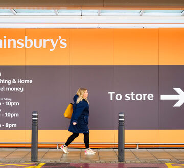 Shopper entering popular Sainsbury's store