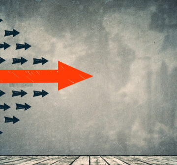 Arrows on Concrete Wall Background Concept Indicating Direction