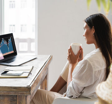 Business woman at a table in front of laptop