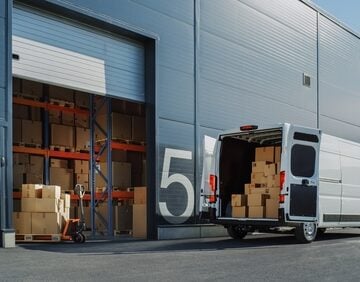 Delivery Van Loaded Outside Logistics Warehouse