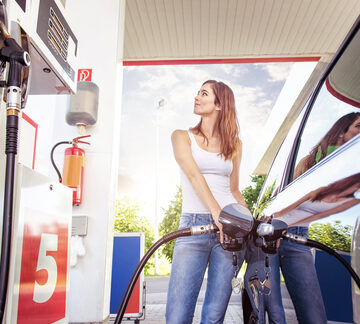 Woman Refuelling a Car
