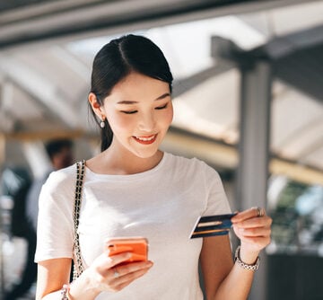 Happy Asian woman shopping