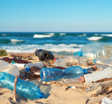 Spilled plastic garbage on the beach