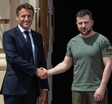 French President Emmanuel Macron and Ukrainian President Volodymyr Zelensky shake hands