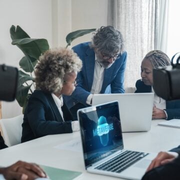 Business people using virtual reality goggles