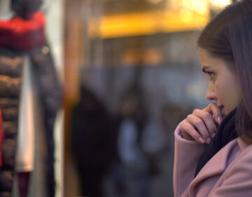 lady deciding on clothing purchase