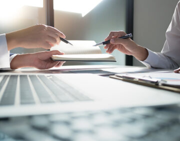 Business People looking over spreadsheets