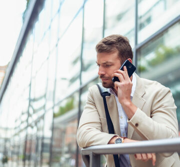 Unhappy,Businessman,Talking,On,Phone Unhappy Businessman Talking on Phone