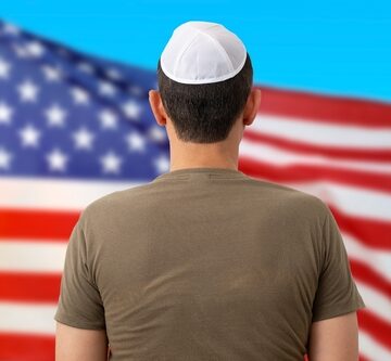 Back View of Jewish Man Wearing Yarmulke In Front of U.S. flag