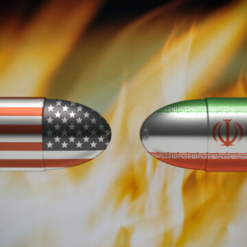 two bullets, nose-to-nose, with the U.S. and Iran flags on their sides