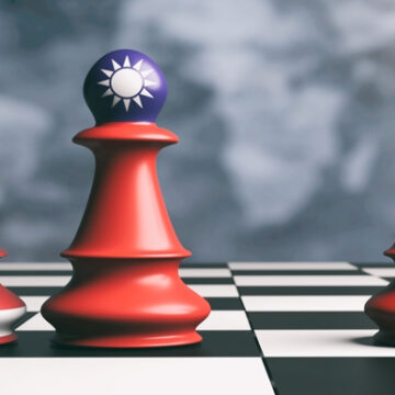 Chess pieces with U.S., China and Taiwan flag icons