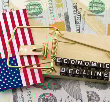 Concept of U.S. flag in Economic Decline mouse trap with currency in background