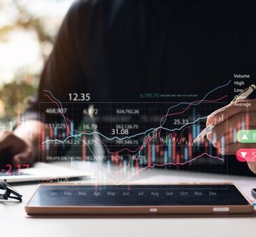Businessmen With Stock Market Investment Tools To Analyze