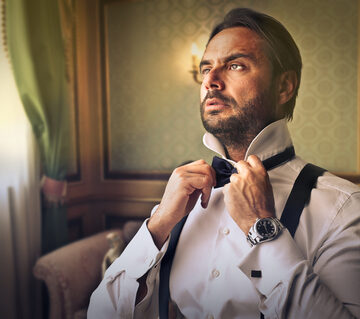 Man Dressing In Tuxedo