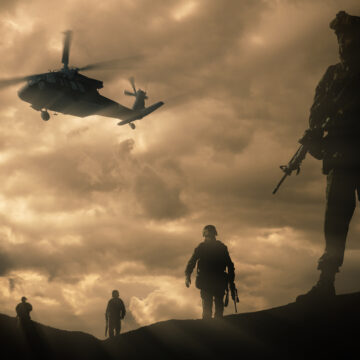 Military,Silhouettes,Of,Soldiers,Against,The,Backdrop,Of,Sunset,Sky. Military Silhouettes Of Soldiers And Helicopter Against The Backdrop Of Cloudy Sky