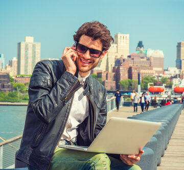 Businessman,Enjoying,Working,Outside.,Wearing,Leather,Jacket,,Sunglasses,,A,Guy SPOTLIGHT: TOP TREND 2023, OFFICE BUILDING BUST