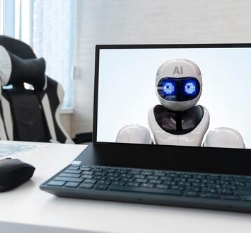 Replacing,A,Person,With,Artificial,Intelligence.,Laptop,With,Robot,On Top Trend 2023, AI – We Own You: WHAT TO DO WITH ALL OF AI’S DISPLACED WORKERS?