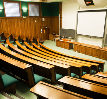 An Empty Wood-Panelled University Lecture Hall