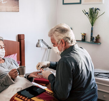 Sick Elderly Woman of Covid-19 Lies In Bed At Home