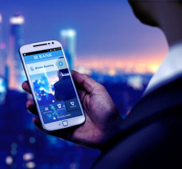 Businessman On Smartphone Using Banking App