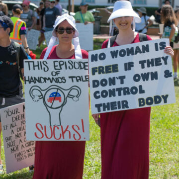 Pro-choice protesters with large signs.