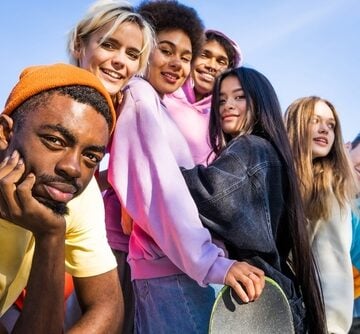 Multicultural Group Of Gen Z- and millennial-aged Friends Bonding Outdoors