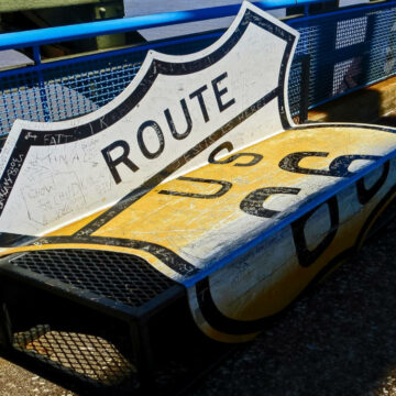 Damaged Route 66 road sign.