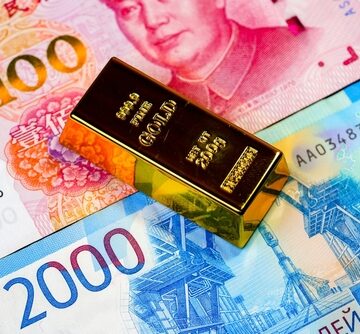 Gold Bar on top of 100 and 2000 Yuan Banknotes