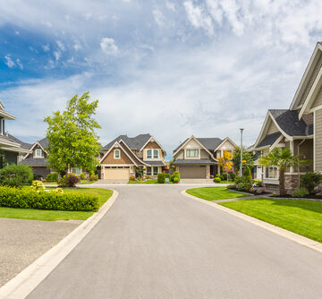 Nicely Trimmed And Manicured Gardens In Front Of Luxury Homes