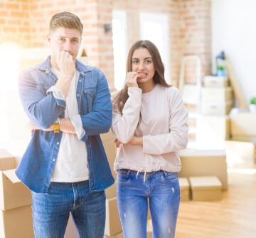 Beautiful,Young,Couple,Moving,To,A,New,House,Looking,Stressed Young Couple Moving Into A New House Looking Stressed