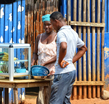 African,Street,Vendor,Sells,Local,Products.,Street,Stall,With,Food MORE THAN 63 PERCENT OF NIGERIANS ARE “MULTIDIMENSIONALLY POOR,” STUDY SAYS