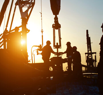 Oil Workers Drilling For Oil
