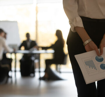 CloseUp View Of Businesswoman Holding Financial Stats