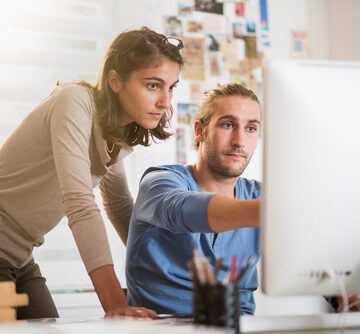 Two,Young,Colleagues,Working,On,A,Project,On,Computer AI TO ADVERTISERS: UP YOUR GAME