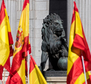 Sculpture,Of,Lion,In,The,Congress,Of,Deputies,Of,Madrid Sculpture Of Lion And Flags In Front Of The Congress Of Deputies In Madrid