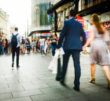 Abstract Blurred Image Of Shoppers On Busy Street