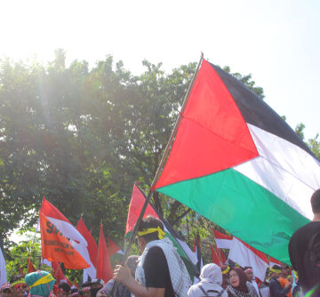 Palestinian Crowd Waves Flag and Hold Protests