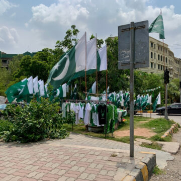 Palestinian Shirts And Flags Being Sold On A Street Corner