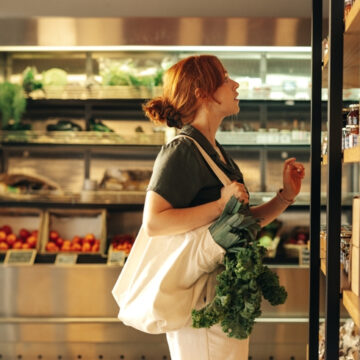 Women Debating Choices In Grocery Store