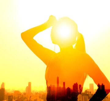Double Exposure Graphic Image Of Woman With City Skyline In Background