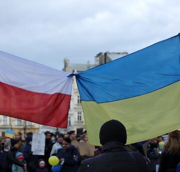 Flags of Ukraine and Poland Displayed in a Crown in Krakow, Poland